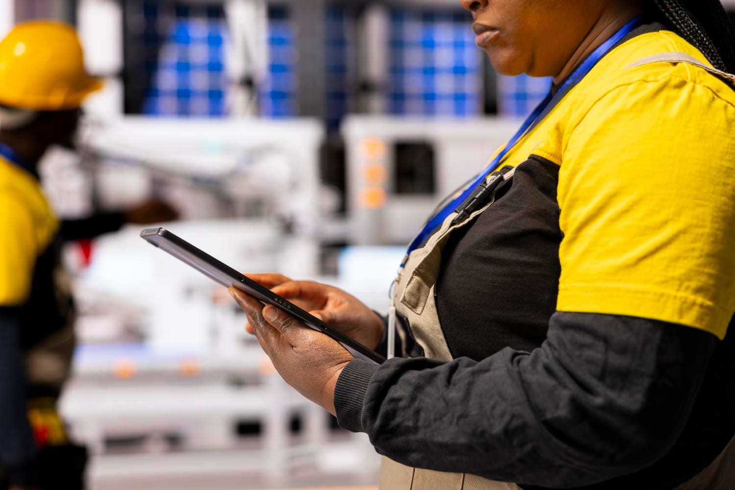 Industrial engineer reviewing plant information on a tablet